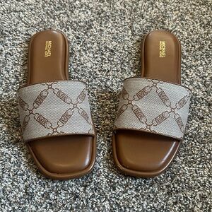 Michael Kors Hayworth Slide Sandals. (See scuff on toe in photo) Size 9M
